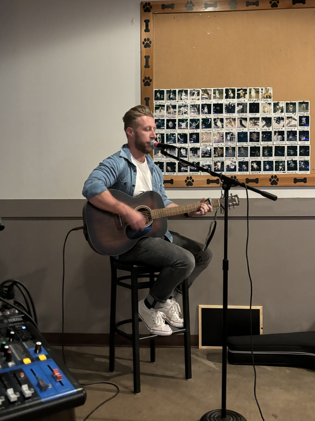 Jared playing guitar at a Denver open mic